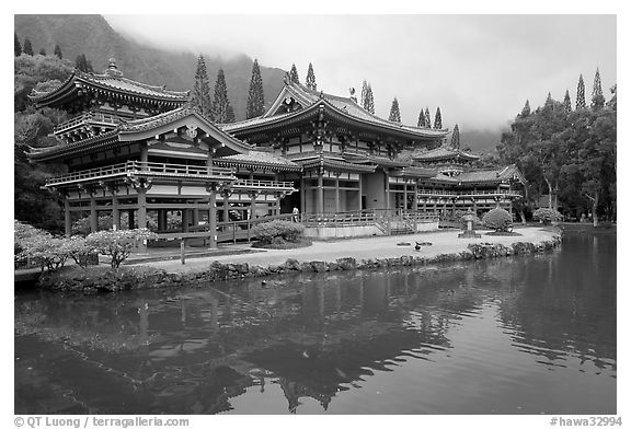 Byodo-In temple reflected in pond on a cloudy day. Oahu island, Hawaii, USA