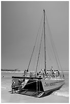 Catamaran landing on Waikiki Beach. Waikiki, Honolulu, Oahu island, Hawaii, USA ( black and white)