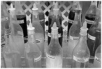 Variety of sirup flavors used in shave ice. Waikiki, Honolulu, Oahu island, Hawaii, USA (black and white)