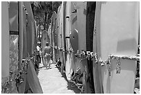 Racks of surfboards. Waikiki, Honolulu, Oahu island, Hawaii, USA (black and white)