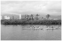 Outrigger canoe along the Ala Wai Canal. Waikiki, Honolulu, Oahu island, Hawaii, USA (black and white)