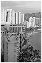 High rise hotels and beach seen from the Sheraton glass elevator, late afternoon. Waikiki, Honolulu, Oahu island, Hawaii, USA (black and white)