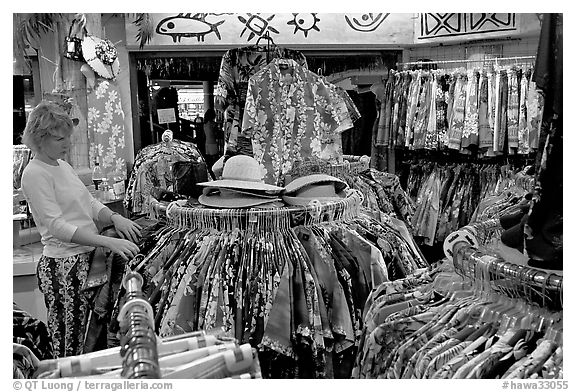 Woman shopping hawaiian dresses. Waikiki, Honolulu, Oahu island, Hawaii, USA (black and white)