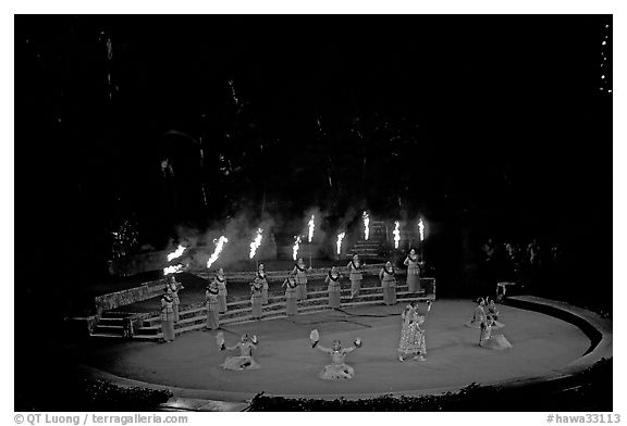 Wedding procession led by torch bearers performed by Tahitian dancers. Polynesian Cultural Center, Oahu island, Hawaii, USA (black and white)