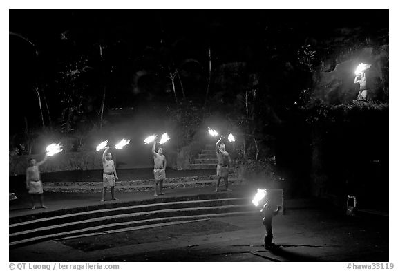 Dance with fire performed by Samoans. Polynesian Cultural Center, Oahu island, Hawaii, USA (black and white)