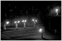 Dance with fire performed by Samoans. Polynesian Cultural Center, Oahu island, Hawaii, USA (black and white)
