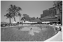 Swimming pool, Halekulani hotel. Waikiki, Honolulu, Oahu island, Hawaii, USA (black and white)