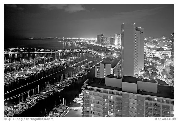 Ala Wai Yatch Harbor and skyline at night. Waikiki, Honolulu, Oahu island, Hawaii, USA (black and white)