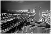 Ala Wai Yatch Harbor and skyline at night. Waikiki, Honolulu, Oahu island, Hawaii, USA (black and white)