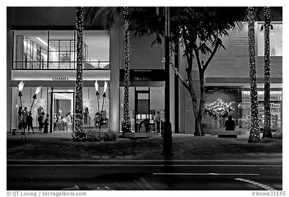 Shopping section of Kalakaua avenue at night. Waikiki, Honolulu, Oahu island, Hawaii, USA (black and white)