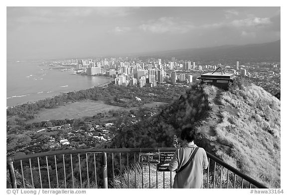 Tourist on Diamond Head crater summit observation platform. Oahu island, Hawaii, USA (black and white)