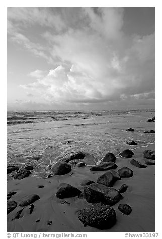 Boulders, beach and clouds, Lydgate Park, sunrise. Kauai island, Hawaii, USA