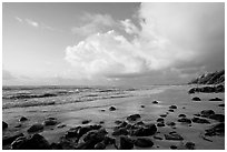 Boulders, beach and clouds, Lydgate Park, sunrise. Kauai island, Hawaii, USA (black and white)