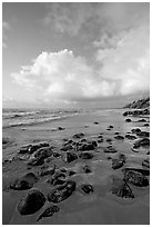 Boulders, coastline, and clouds, Lydgate Park, sunrise. Kauai island, Hawaii, USA ( black and white)