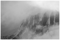 Fluted ridges seen through clouds, Kalalau lookout, late afternoon. Kauai island, Hawaii, USA ( black and white)