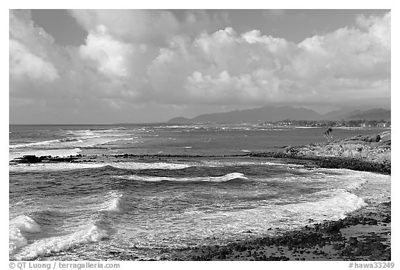 Coastline north of Kapaa with Sleeping Giant profile, early morning. Kauai island, Hawaii, USA