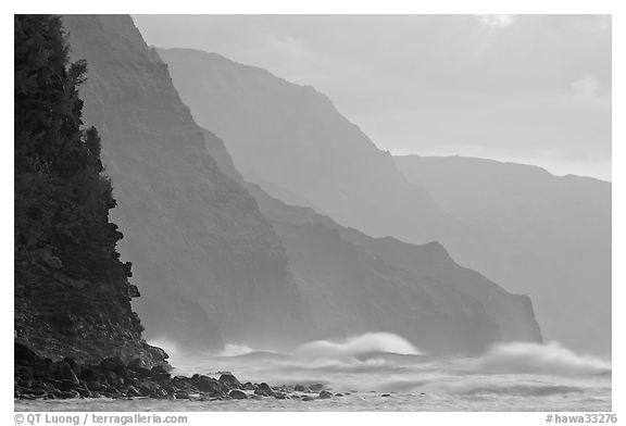 Na Pali Coast and surf seen from Kee Beach, sunset. Kauai island, Hawaii, USA