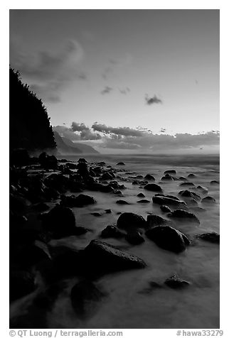 Boulders and misty surf from Kee Beach, dusk. Kauai island, Hawaii, USA