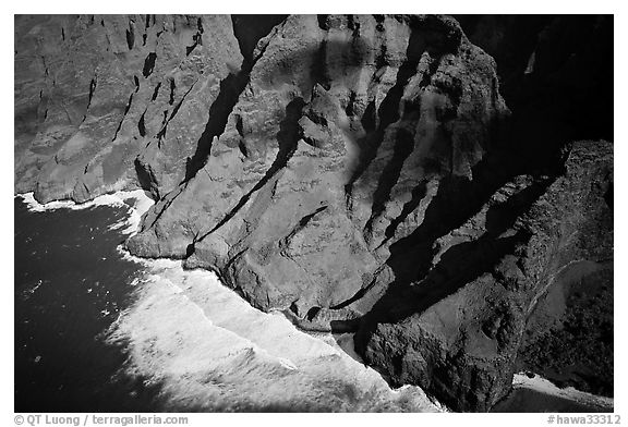 Aerial view of fluted mountains and surf, Na Pali Coast. Kauai island, Hawaii, USA