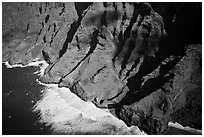 Aerial view of fluted mountains and surf, Na Pali Coast. Kauai island, Hawaii, USA ( black and white)