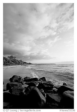 Boulders and beach, Lydgate Park, sunrise. Kauai island, Hawaii, USA (black and white)