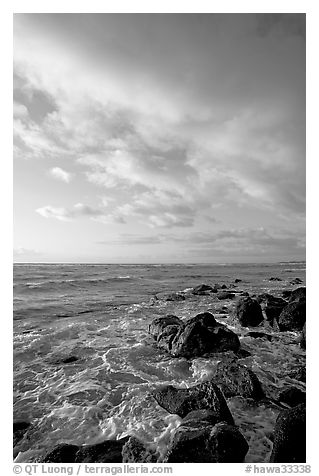 Boulders and ocean, Lydgate Park, sunrise. Kauai island, Hawaii, USA (black and white)