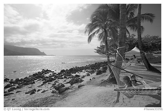 Family on Hammock, Puu Poa Beach. Kauai island, Hawaii, USA (black and white)