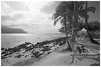 Family on Hammock, Puu Poa Beach. Kauai island, Hawaii, USA (black and white)