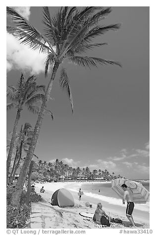 Couple and tent, Sheraton Beach, mid-day. Kauai island, Hawaii, USA