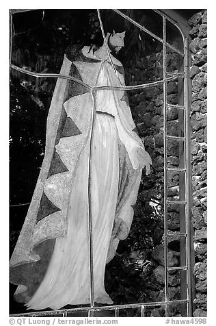 A stained glass with Jesus in traditional hawaiian robe, Palapala Hoomau church. Maui, Hawaii, USA