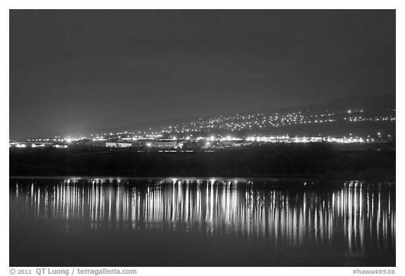 Lights reflected in Aimakapa Fishpond, Kaloko-Honokohau National Historical Park. Hawaii, USA