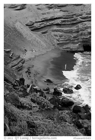 Beachgoers and green sand beach near South Point. Big Island, Hawaii, USA (black and white)