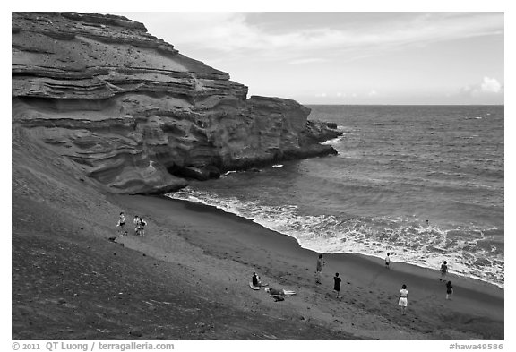 People on Mahana (green sand) Beach. Big Island, Hawaii, USA (black and white)