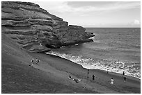 People on Mahana (green sand) Beach. Big Island, Hawaii, USA ( black and white)