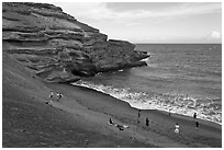 People on Mahana (green sand) Beach. Big Island, Hawaii, USA (black and white)