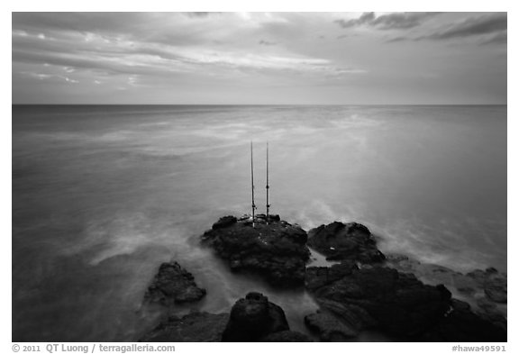 Fishing rods at sunset, Ka Lea (South Point). Big Island, Hawaii, USA