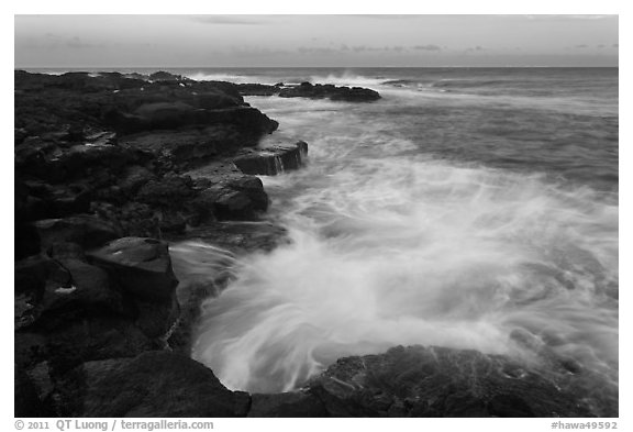 Surf and lava shoreline at sunset, South Point. Big Island, Hawaii, USA (black and white)