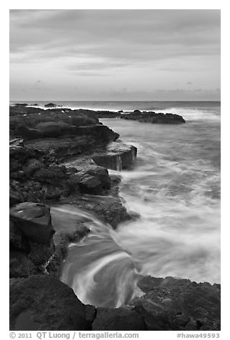 Surf and volcanic shore at sunset, South Point. Big Island, Hawaii, USA (black and white)
