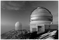 Recent snow and telescopes at sunset. Mauna Kea, Big Island, Hawaii, USA (black and white)