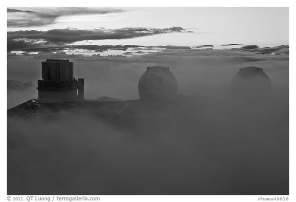 Telescopes, clouds, and fog at sunset. Mauna Kea, Big Island, Hawaii, USA (black and white)