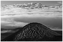 Dark cinder cone and sea of clouds. Mauna Kea, Big Island, Hawaii, USA ( black and white)