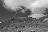 Cinder cone covered with grass, clouds. Big Island, Hawaii, USA ( black and white)