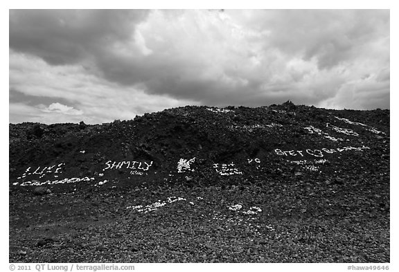 Words made with light rocks against dark lava rocks. Big Island, Hawaii, USA (black and white)