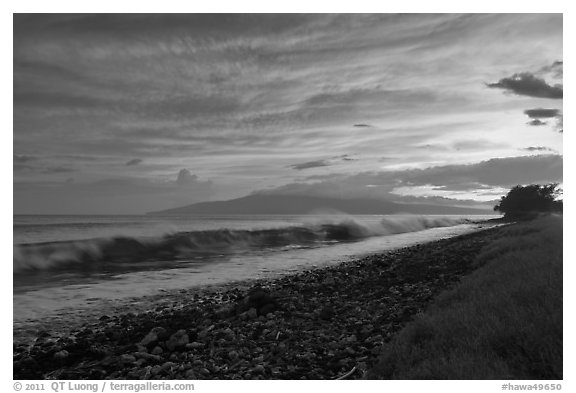 Crashing wave, Lanai Island, and colorful sunset clouds. Lahaina, Maui, Hawaii, USA (black and white)