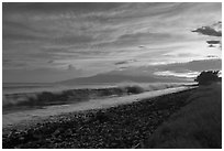 Crashing wave, Lanai Island, and colorful sunset clouds. Lahaina, Maui, Hawaii, USA ( black and white)