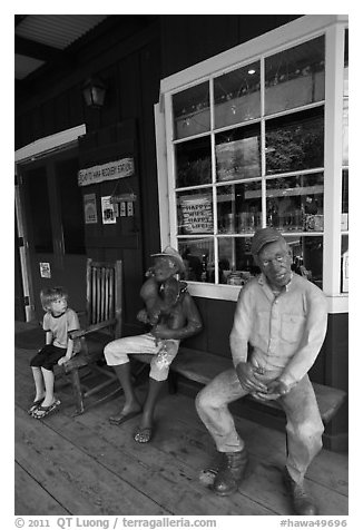 Boy looking at quirky sculptures, Ulupalakua. Maui, Hawaii, USA (black and white)