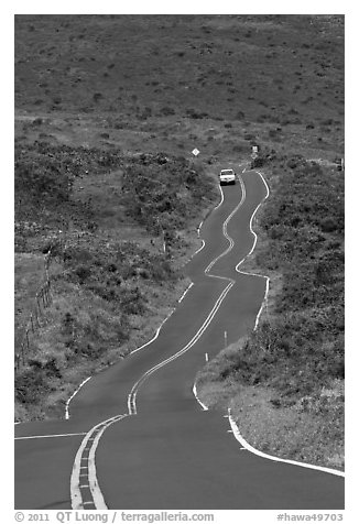 Car on winding Pilani Highway. Maui, Hawaii, USA (black and white)