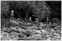 Rock piles on Hanakapiai Beach. Kauai island, Hawaii, USA (black and white)