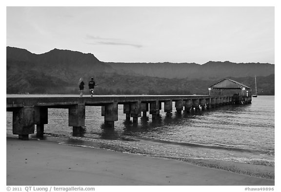 Conversation on Hanalei Pier. Kauai island, Hawaii, USA