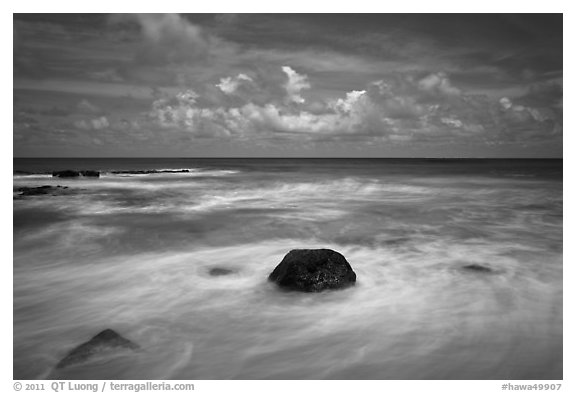 Volcanic rock and wave motion. Kauai island, Hawaii, USA (black and white)